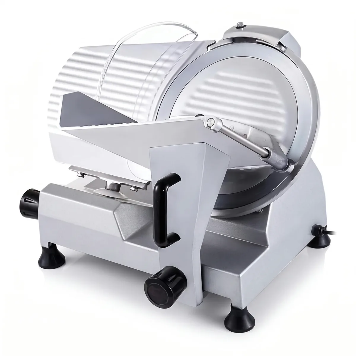 Silver electric food slicer with a round ribbed metal blade, a clear curved guard over the top, a sliding food carriage with a black handle and a pusher arm.