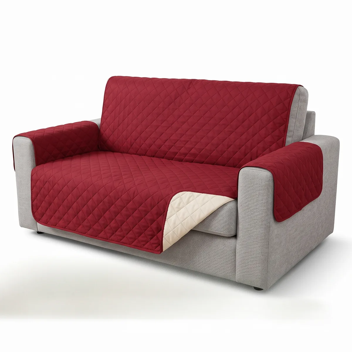 Light grey two-seat sofa on a plain white background, covered by a dark red diamond-quilted sofa cover over the backrest, seat and both armrests.